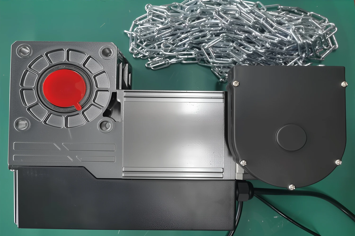 Close-up of a heavy-duty encrypted servo motor with a manual override chain, engineered by ABX for secure industrial access control and precise overhead door remote programming.